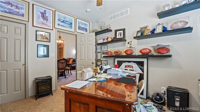 1126 Buckingham Dr, Camdenton, MO 65020 - carpeted home office featuring a chandelier and a wood stove