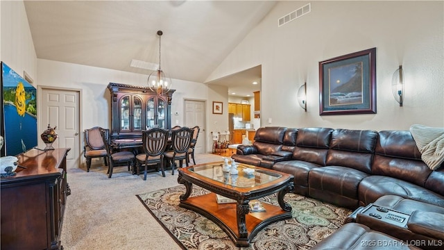 1126 Buckingham Dr, Camdenton, MO 65020 - living room with light carpet, vaulted ceiling, and a chandelier