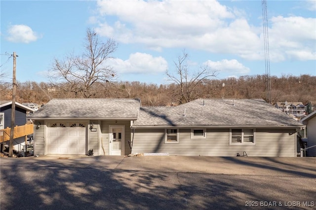 740 Twin Valley Loop, Linn Creek, MO 65052 - view of front of house with a garage, driveway, and a shingled roof