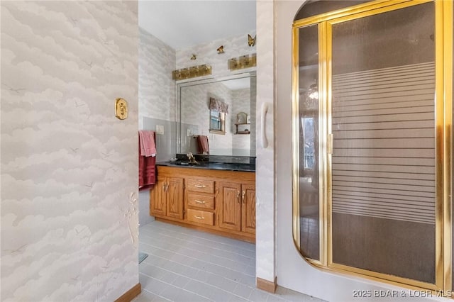 740 Twin Valley Loop, Linn Creek, MO 65052 - bathroom with wallpapered walls, vanity, tile patterned floors, and a stall shower