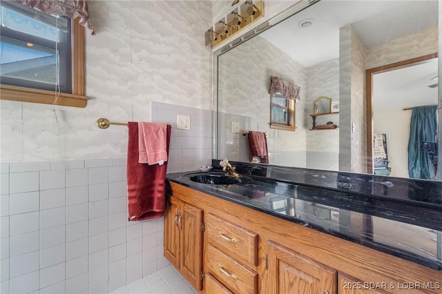740 Twin Valley Loop, Linn Creek, MO 65052 - bathroom featuring vanity, wallpapered walls, tile patterned flooring, and tile walls
