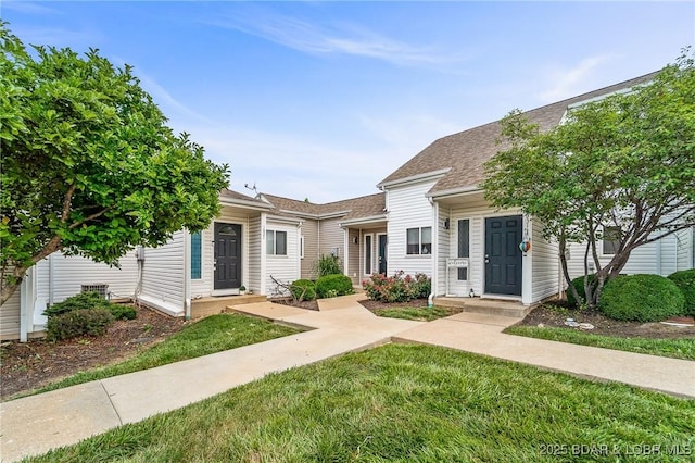 1629 Timber Creek Dr Unit 1629, Columbia, MO 65202 - townhome / multi-family property featuring a shingled roof and a front lawn