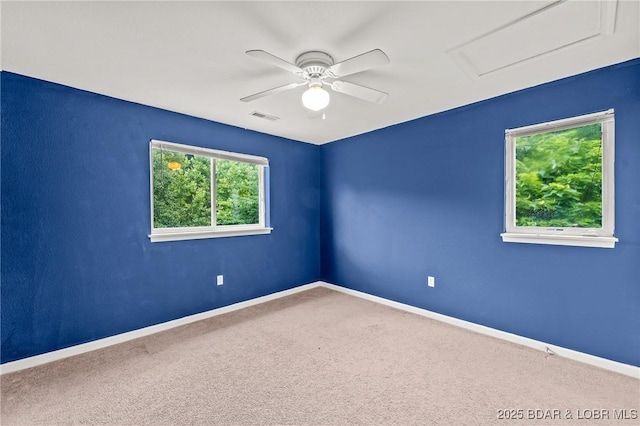 1629 Timber Creek Dr Unit 1629, Columbia, MO 65202 - empty room with ceiling fan, attic access, and carpet floors