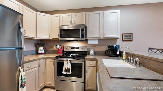 133 Cedar Glen Dr Unit 3B, Camdenton, MO 65020 - kitchen featuring appliances with stainless steel finishes, light countertops, and white cabinetry