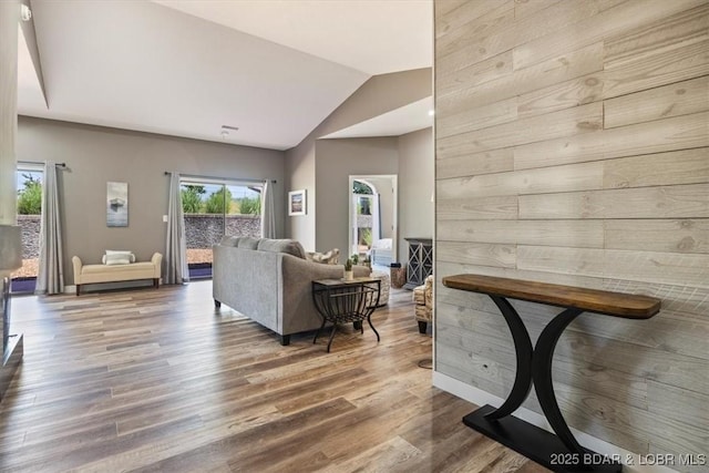 576 Racquet Club Dr Unit 407, Lake Ozark, MO 65049 - living room featuring wood finished floors and lofted ceiling