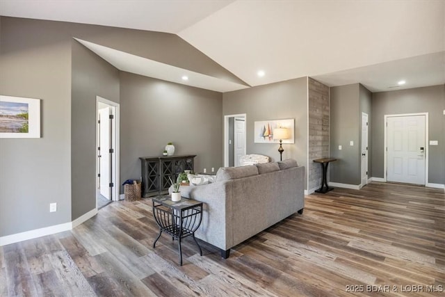 576 Racquet Club Dr Unit 407, Lake Ozark, MO 65049 - living room with wood finished floors, vaulted ceiling, and recessed lighting