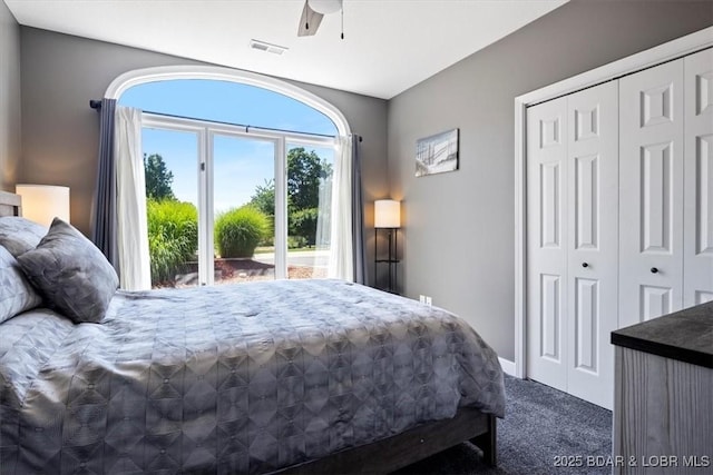576 Racquet Club Dr Unit 407, Lake Ozark, MO 65049 - carpeted bedroom featuring a closet and a ceiling fan