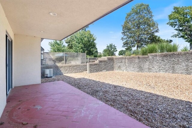 576 Racquet Club Dr Unit 407, Lake Ozark, MO 65049 - fenced backyard with a patio