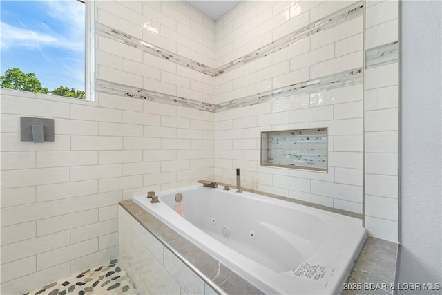 40 Walnut Ct, Eldon, MO 65026 - full bathroom featuring a whirlpool tub and tile walls