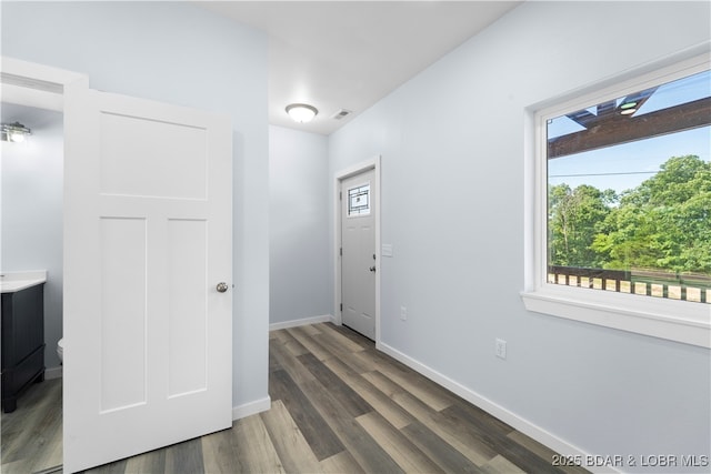 40 Walnut Ct, Eldon, MO 65026 - foyer with healthy amount of natural light and wood finished floors
