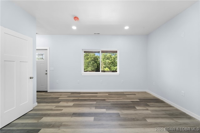 40 Walnut Ct, Eldon, MO 65026 - unfurnished room featuring healthy amount of natural light, wood finished floors, recessed lighting, and a smoke detector