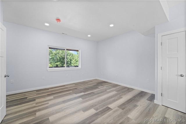 40 Walnut Ct, Eldon, MO 65026 - spare room featuring light wood-style flooring and recessed lighting