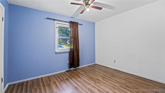 124 Frontier Cir, Linn Creek, MO 65052 - empty room with wood finished floors and a ceiling fan