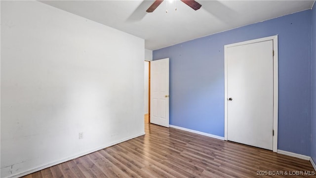 124 Frontier Cir, Linn Creek, MO 65052 - unfurnished bedroom with wood finished floors and a ceiling fan