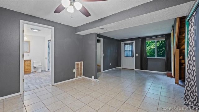 124 Frontier Cir, Linn Creek, MO 65052 - empty room featuring a ceiling fan, light tile patterned flooring, and a textured ceiling