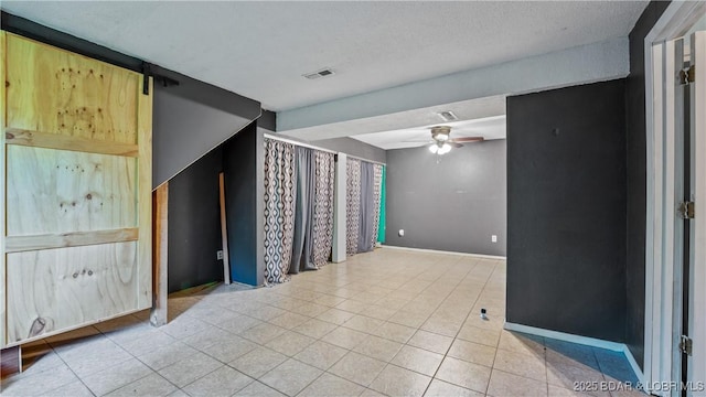 124 Frontier Cir, Linn Creek, MO 65052 - empty room with a ceiling fan and tile patterned flooring