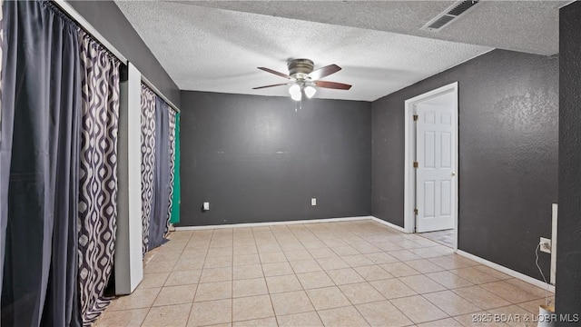 124 Frontier Cir, Linn Creek, MO 65052 - unfurnished room with ceiling fan, a textured ceiling, and light tile patterned floors
