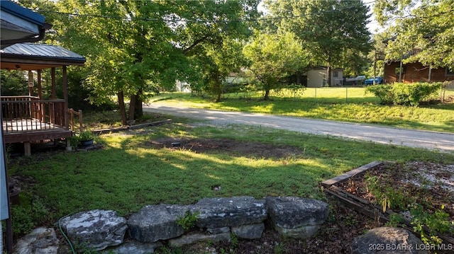 124 Frontier Cir, Linn Creek, MO 65052 - view of grassy yard featuring a wooden deck