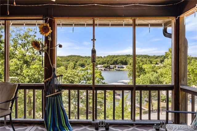 19 Catalpa Ct Unit 2D, Lake Ozark, MO 65049 - unfurnished sunroom with a water view