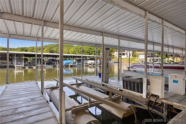 19 Catalpa Ct Unit 2D, Lake Ozark, MO 65049 - dock area featuring boat lift and a water view