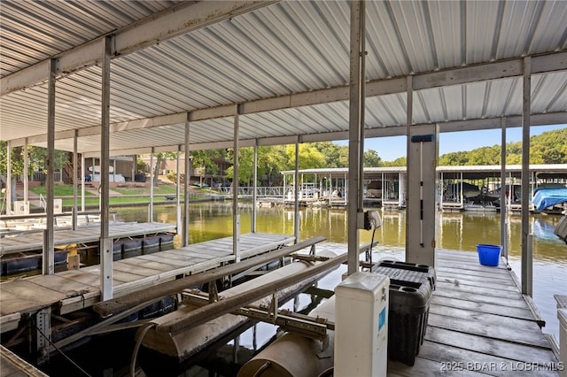 19 Catalpa Ct Unit 2D, Lake Ozark, MO 65049 - dock area with boat lift and a water view
