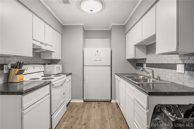 19 Catalpa Ct Unit 2C, Lake Ozark, MO 65049 - kitchen featuring white appliances, under cabinet range hood, a textured ceiling, white cabinetry, and ornamental molding