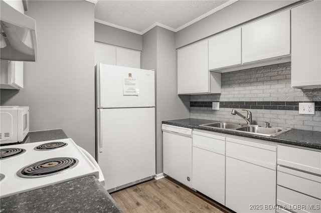 19 Catalpa Ct Unit 2C, Lake Ozark, MO 65049 - kitchen featuring white appliances, extractor fan, light wood finished floors, white cabinets, and tasteful backsplash