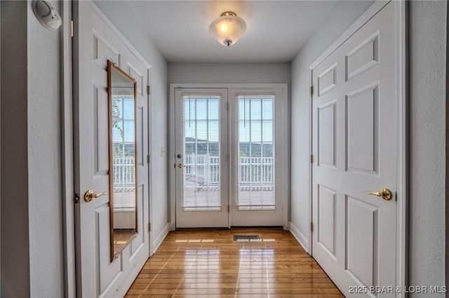 1480 Copperstone Rd, Camdenton, MO 65020 - doorway to outside featuring light wood-style floors and baseboards