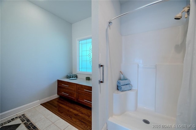1480 Copperstone Rd, Camdenton, MO 65020 - bathroom with curtained shower, vanity, and tile patterned floors