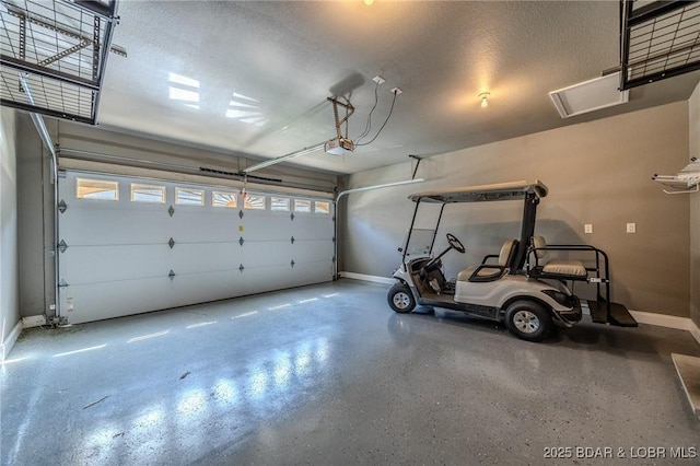 893 Winetavern Rd, Osage Beach, MO 65065 - garage with baseboards and a garage door opener