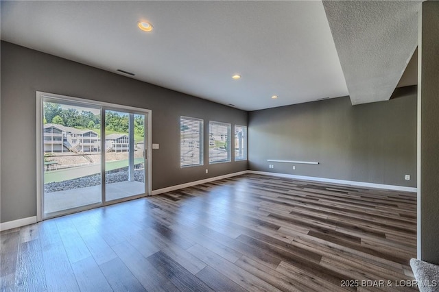 893 Winetavern Rd, Osage Beach, MO 65065 - spare room featuring healthy amount of natural light, wood finished floors, and recessed lighting