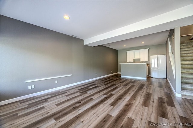893 Winetavern Rd, Osage Beach, MO 65065 - unfurnished living room with stairway, dark wood-style flooring, and recessed lighting