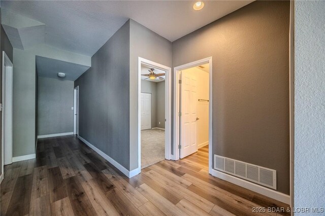 893 Winetavern Rd, Osage Beach, MO 65065 - hall featuring wood finished floors and baseboards