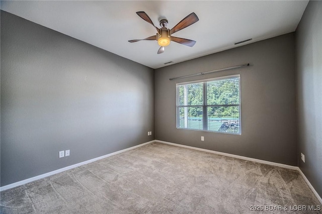 893 Winetavern Rd, Osage Beach, MO 65065 - carpeted spare room featuring baseboards and a ceiling fan