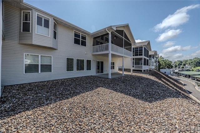 893 Winetavern Rd, Osage Beach, MO 65065 - back of house featuring a patio, a balcony, and a ceiling fan