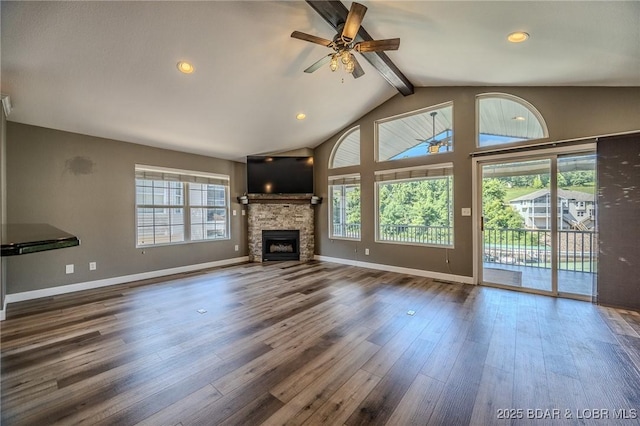 893 Winetavern Rd, Osage Beach, MO 65065 - unfurnished living room featuring beamed ceiling, ceiling fan, wood finished floors, a stone fireplace, and recessed lighting