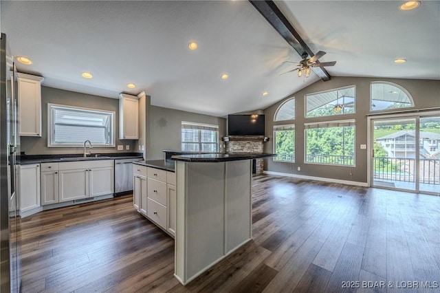 893 Winetavern Rd, Osage Beach, MO 65065 - kitchen with open floor plan, dishwasher, ceiling fan, dark countertops, and dark wood-style floors