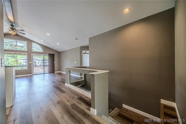 893 Winetavern Rd, Osage Beach, MO 65065 - unfurnished living room featuring lofted ceiling, wood finished floors, a ceiling fan, and recessed lighting