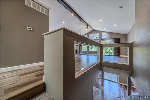 893 Winetavern Rd, Osage Beach, MO 65065 - staircase with a textured wall, wood finished floors, ceiling fan, and recessed lighting