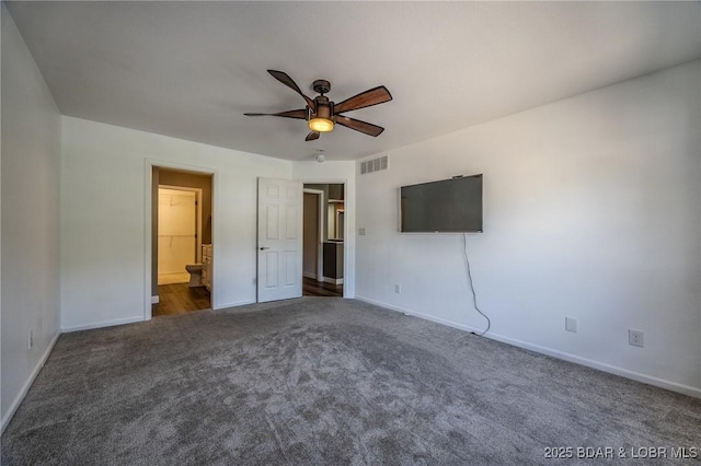 893 Winetavern Rd, Osage Beach, MO 65065 - unfurnished bedroom with carpet floors, a ceiling fan, and ensuite bath