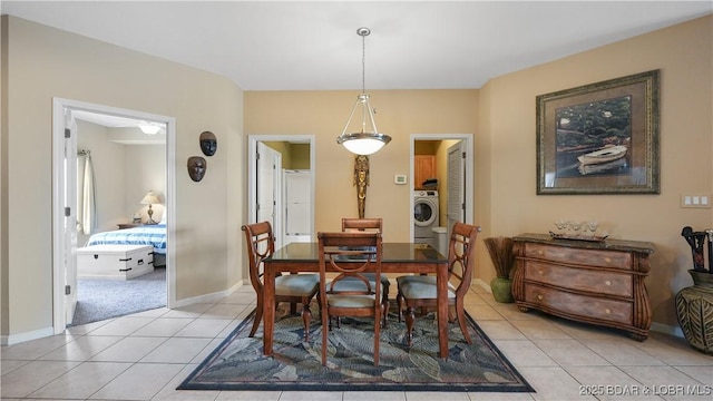 1230 Lands End Pkwy Unit 304, Osage Beach, MO 65065 - dining space with washer / clothes dryer and light tile patterned floors