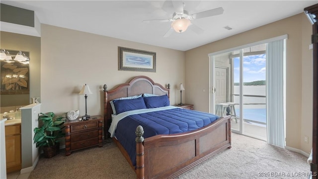1230 Lands End Pkwy Unit 304, Osage Beach, MO 65065 - bedroom featuring access to exterior, light carpet, ensuite bathroom, a water view, and a ceiling fan