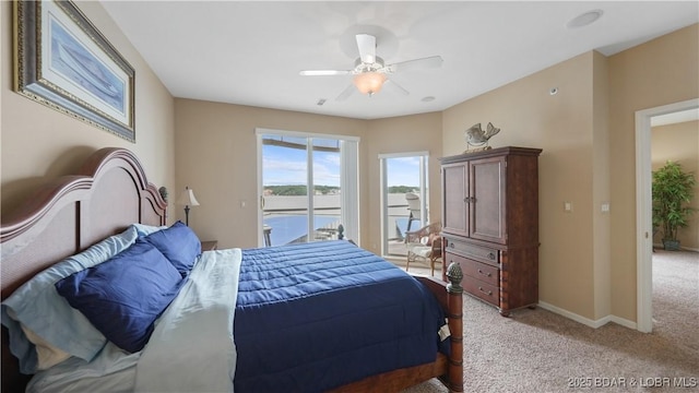 1230 Lands End Pkwy Unit 304, Osage Beach, MO 65065 - bedroom with access to exterior, light carpet, a water view, and ceiling fan
