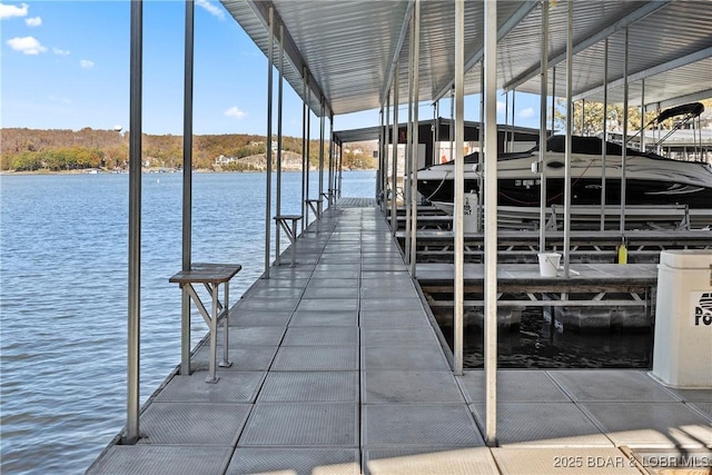 278 Lone Oak Pt Unit 18, Sunrise Beach, MO 65079 - dock with boat lift and a water view