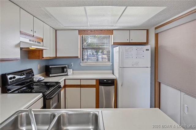 278 Lone Oak Pt Unit 18, Sunrise Beach, MO 65079 - kitchen featuring freestanding refrigerator, black electric range oven, stainless steel microwave, under cabinet range hood, and light countertops