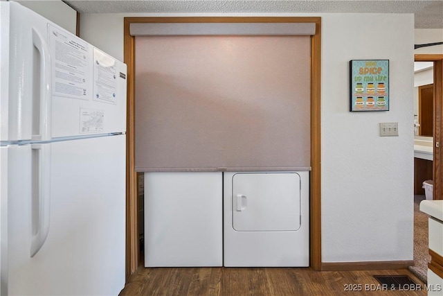 278 Lone Oak Pt Unit 18, Sunrise Beach, MO 65079 - laundry area with washer and clothes dryer and wood finished floors