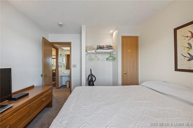 278 Lone Oak Pt Unit 18, Sunrise Beach, MO 65079 - bedroom featuring dark colored carpet and a textured ceiling