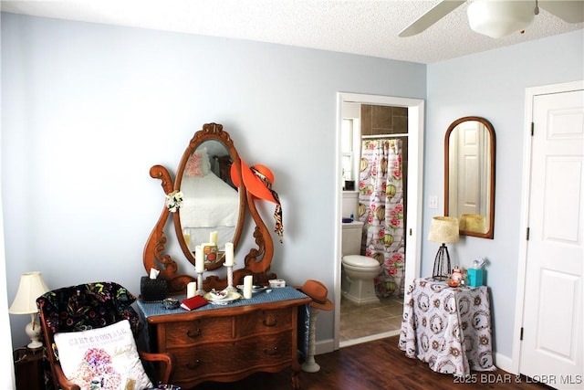 891 Azalea Ct, Osage Beach, MO 65065 - living area with wood finished floors, a ceiling fan, and a textured ceiling