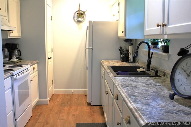 891 Azalea Ct, Osage Beach, MO 65065 - kitchen with white range with electric cooktop, light wood-style flooring, and white cabinetry