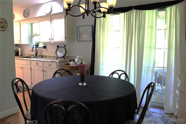 891 Azalea Ct, Osage Beach, MO 65065 - dining space with a chandelier